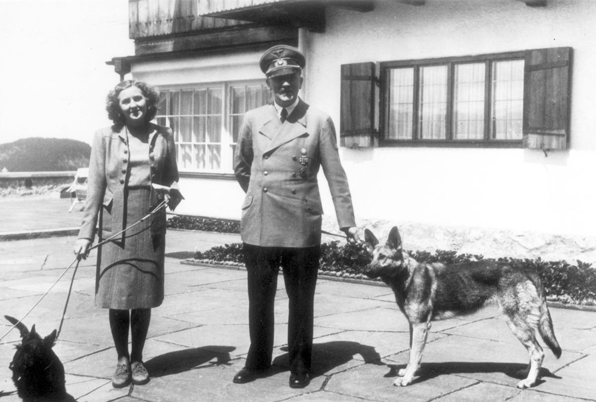Adolf Hitler and Eva Braun, with their dogs at the Berghof, from Eva Braun's albums
